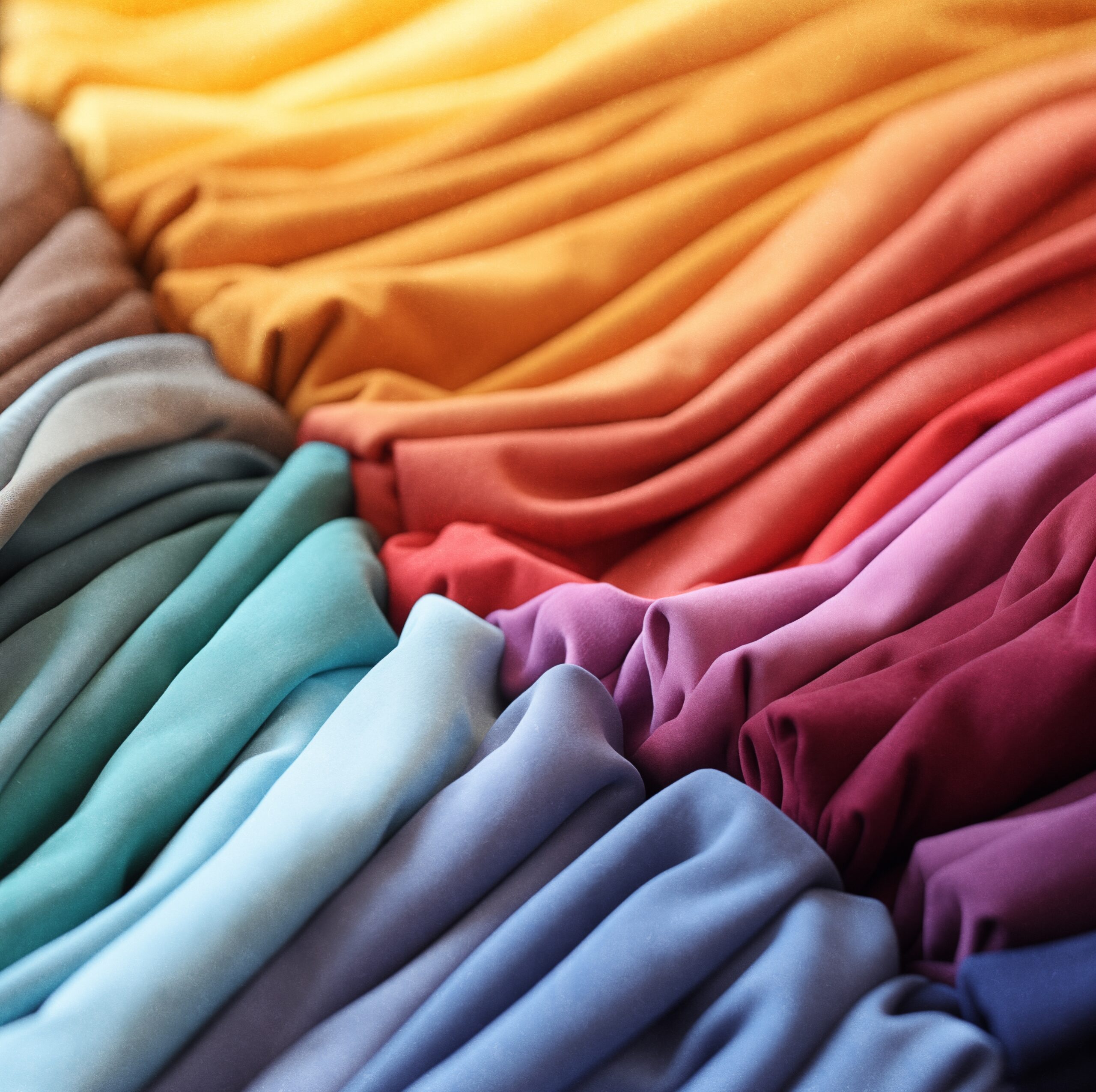 Pile,Of,Colorful,Folded,T-shirts.closeup,Of,A,Fashion,Garment,With